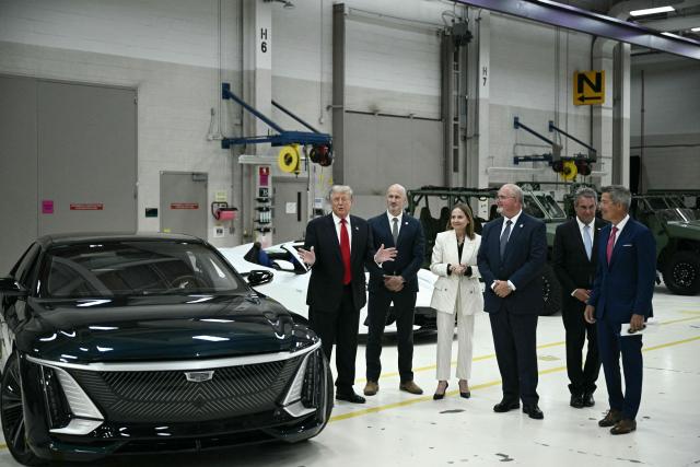 (From L) US President Donald Trump speaks as he tours General Motors' Milford Proving Ground in Milford, Michigan, on July 27, 2026. (Photo by Brendan SMIALOWSKI / AFP)