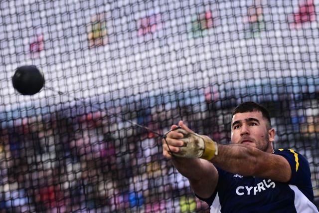 Cyprus' Iosif Kesidis competes in the men's hammer throw final during the athletics event at the Scotstoun Stadium in Glasgow, on day four of the Commonwealth Games in Glasgow, Scotland, on July 27, 2026. (Photo by Ben STANSALL / AFP)