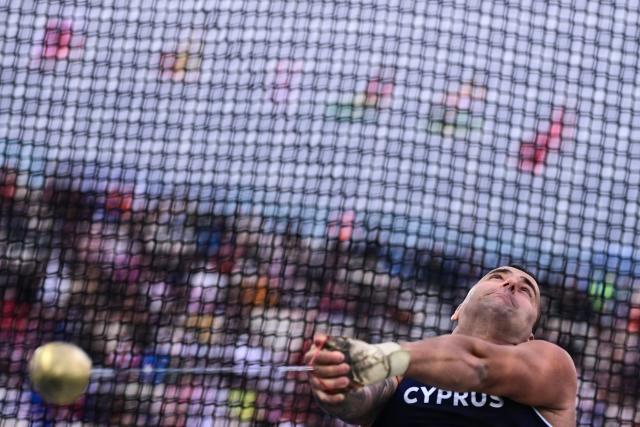 Cyprus' Alexandros Poursanidis competes in the men's hammer throw final during the athletics event at the Scotstoun Stadium in Glasgow, on day four of the Commonwealth Games in Glasgow, Scotland, on July 27, 2026. (Photo by Ben STANSALL / AFP)