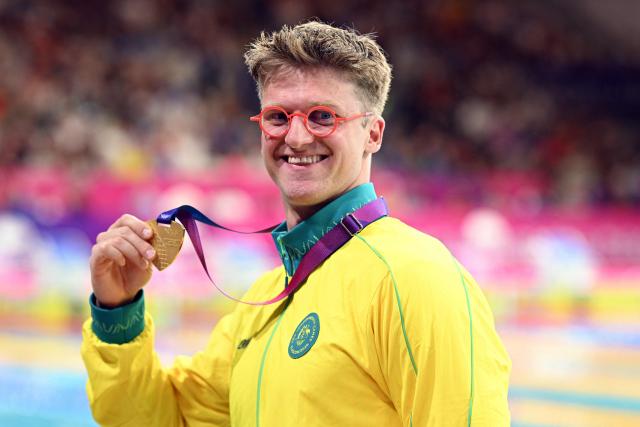 Gold medallist Australia's Sam Williamson celebrates during the Men's 50m Breaststroke Medal Ceremony at the swimming event at the Tollcross International Swimming Centre in Glasgow, on day four of the Commonwealth Games in Glasgow, Scotland, on July 27, 2026. (Photo by Oli SCARFF / AFP)