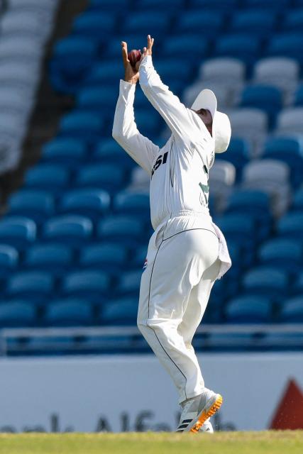 Fielder Ali Usman of Pakistan takes the catch to dismiss Tagenarine Chanderpaul of West Indies (unseen) for 35 runs during the third day of the first Test cricket match between West Indies and Pakistan at the Brian Lara Cricket Academy in Tarouba, Trinidad and Tobago, on July 27, 2026. (Photo by Randy Brooks / AFP)