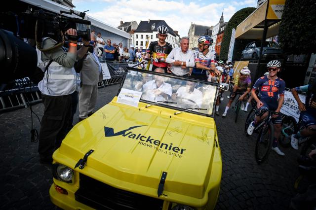 UAE Team Emirates-XRG's Belgian Rune Herregodts, Former Belgian cyclist Lucien Van Impe and Red Bull - BORA - hansgrohe team's Belgian rider Remco Evenepoel stand in a car before the 'Natourcriterium Aalst' cycling event, in Aalst, some 30 km from Brussels, on July 27, 2026, a day after the Tour de France cycling race. (Photo by ELIAS ROM / Belga / AFP) / Belgium OUT