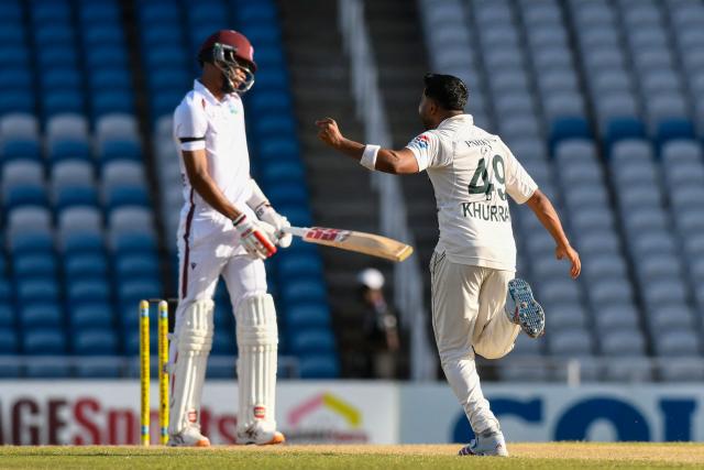 Bowler Khurram Shahzad of Pakistan celebrates after batsman Roston Chase (L) of West Indies was caught behind for 8 runs during the third day of the first Test cricket match between West Indies and Pakistan at the Brian Lara Cricket Academy in Tarouba, Trinidad and Tobago, on July 27, 2026. (Photo by Randy Brooks / AFP)