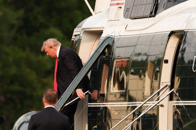 US President Donald Trump steps off Marine One after landing on the Ellipse near the White House in Washington, DC, on July 27, 2026. Trump is returning  from Milford, Michigan where he visited General Motors' vehicle testing site Milford Proving Ground. (Photo by Aaron Schwartz / AFP)