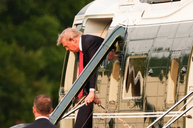 US President Donald Trump steps off Marine One after landing on the Ellipse near the White House in Washington, DC, on July 27, 2026. Trump is returning  from Milford, Michigan where he visited General Motors' vehicle testing site Milford Proving Ground. (Photo by Aaron Schwartz / AFP)