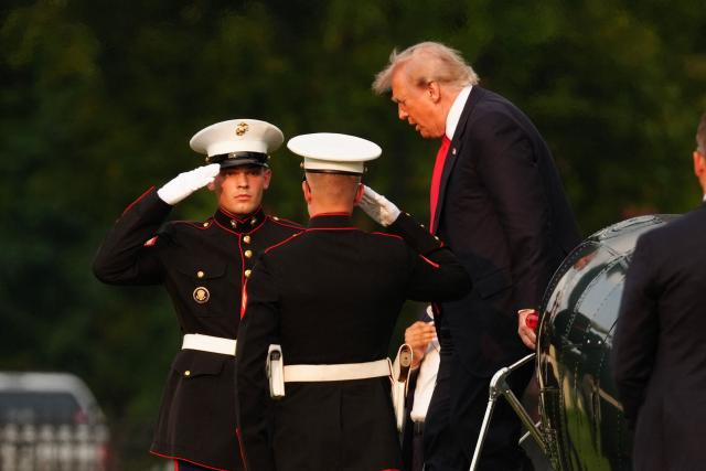 US President Donald Trump steps off Marine One after landing on the Ellipse near the White House in Washington, DC, on July 27, 2026. Trump is returning from Milford, Michigan where he visited General Motors' vehicle testing site Milford Proving Ground. (Photo by Aaron Schwartz / AFP)