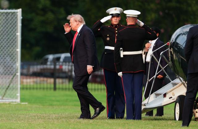 US President Donald Trump steps off Marine One after landing on the Ellipse near the White House in Washington, DC, on July 27, 2026. Trump is returning  from Milford, Michigan where he visited General Motors' vehicle testing site Milford Proving Ground. (Photo by Aaron Schwartz / AFP)