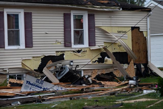 Damaged houses are seen after a tornado ripped through parts of Wisconsin in Menasha, Wisconsin, on July 27, 2026. (Photo by OCTAVIO JONES / AFP)