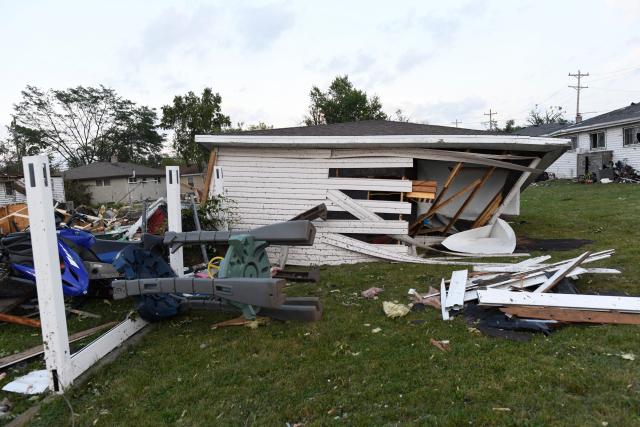 Damaged houses are seen after a tornado ripped through parts of Wisconsin in Menasha, Wisconsin, on July 27, 2026. (Photo by Octavio JONES / AFP)
