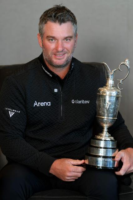 New Zealand golfer Ryan Fox poses with the Open Championship Claret Jug trophy after a press conference in Auckland on July 28, 2026. Fox returned to New Zealand for a public celebration at Takutai Square in Auckland after winning the (British) Open Championship at the Royal Birkdale golf course in England on July 19. (Photo by Ben STRANG / AFP)