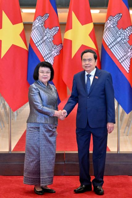 Vietnam's National Assembly Chairman Tran Thanh Man (R) and Cambodia's National Assembly Chairman Samdech Khuon Sudary shake hands during a welcome ceremony at the National Assembly in Hanoi on July 28, 2026. (Photo by Nhac NGUYEN / AFP)
