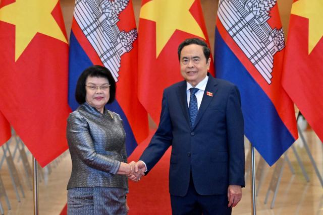 Vietnam's National Assembly Chairman Tran Thanh Man (R) and Cambodia's National Assembly Chairman Samdech Khuon Sudary shake hands during a welcome ceremony at the National Assembly in Hanoi on July 28, 2026. (Photo by Nhac NGUYEN / AFP)