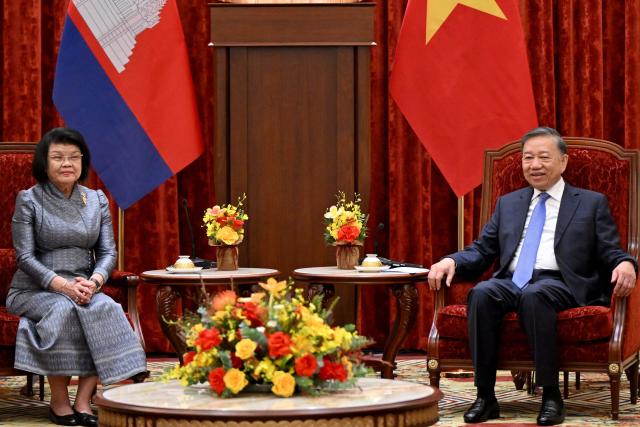 Vietnam's President To Lam (R) attends a meeting with Cambodia's National Assembly Chairman Samdech Khuon Sudary in Hanoi on July 28, 2026. (Photo by Nhac NGUYEN / AFP)