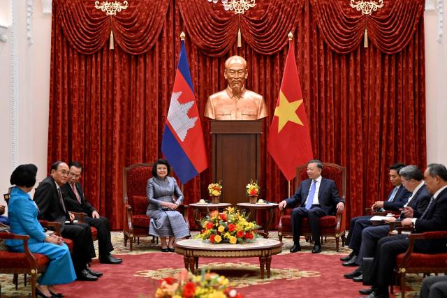 Vietnam's President To Lam (centre R) attends a meeting with Cambodia's National Assembly Chairman Samdech Khuon Sudary (centre L) in Hanoi on July 28, 2026. (Photo by Nhac NGUYEN / AFP)