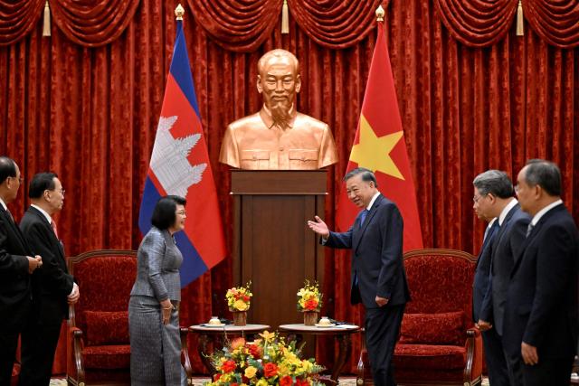 Vietnam's President To Lam (centre R) gestures during a meeting with Cambodia's National Assembly Chairman Samdech Khuon Sudary (centre L) in Hanoi on July 28, 2026. (Photo by Nhac NGUYEN / AFP)
