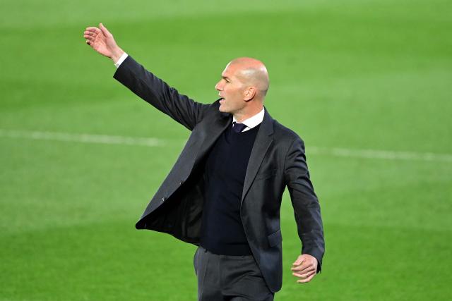 (FILES) Real Madrid's French coach Zinedine Zidane gestures during the Spanish League football match between Real Madrid and Osasuna at the Alfredo Di Stefano stadium in Valdebebas in the outskirts of Madrid on May 1, 2021. The French Football Federation (FFF) will hold a news conference on July 28 to unveil the next coach of the national team, the governing body said. Zinedine Zidane, although not named in the FFF statement, is the overwhelming favourite to succeed Didier Deschamps as France head coach. (Photo by JAVIER SORIANO / AFP)