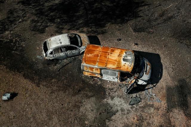 This aerial photograph shows burnt premisses and vehicles destroyed by a wildfire in a business park in Biscarrosse, southwestern France on July 28, 2026. The fire that broke out on July 23, 2026, near Biscarrosse in the Landes region of southwestern France has been "contained," France's President announced on July 27.
The Landes de Gascogne forest, home to maritime pines and a vital "lung" for the timber industry, has seen 42,000 hectares burn near Bordeaux. Forests are catching fire all the more easily because European vegetation and soils have been very dry for monthsa drought exacerbated by climate change and recent exceptional heatwaves. (Photo by Philippe Lopez / AFP)
