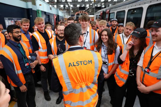 Britain's Prime Minister Andy Burnham meets young people, as he visits French run rail transport systems manufacturer Alstom in Derby, central England on July 28, 2026, on the day he unveils new technical educational routes aimed at tackling youth unemployment. (Photo by Temilade Adelaja / POOL / AFP)