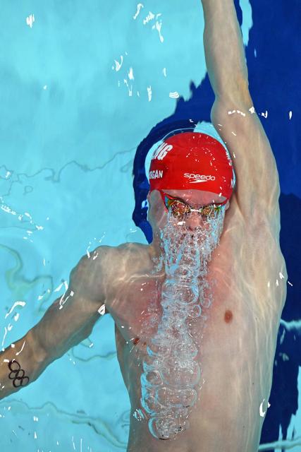 England's Oliver Morgan competes in the Men's 100m Backstroke - Heats at the swimming event at the Tollcross International Swimming Centre in Glasgow, on day five of the Commonwealth Games in Glasgow, Scotland, on July 28, 2026. (Photo by Oli SCARFF / AFP)