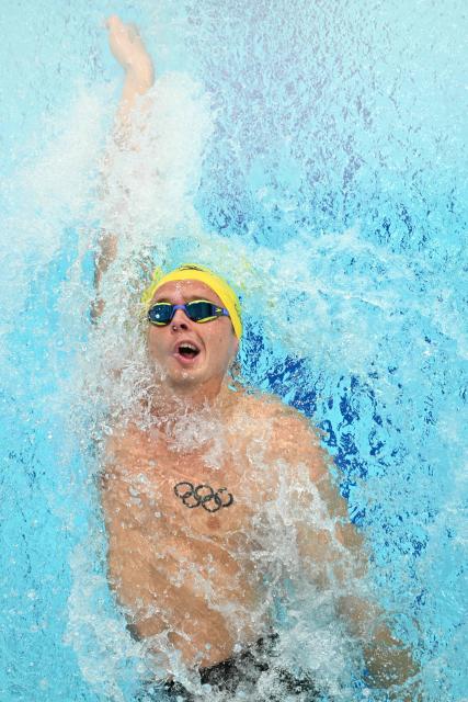 Australia's Isaac Cooper competes in the Men's 100m Backstroke - Heats at the swimming event at the Tollcross International Swimming Centre in Glasgow, on day five of the Commonwealth Games in Glasgow, Scotland, on July 28, 2026. (Photo by Oli SCARFF / AFP)