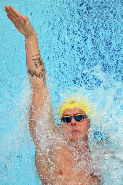 Australia's Isaac Cooper competes in the Men's 100m Backstroke - Heats at the swimming event at the Tollcross International Swimming Centre in Glasgow, on day five of the Commonwealth Games in Glasgow, Scotland, on July 28, 2026. (Photo by Oli SCARFF / AFP)