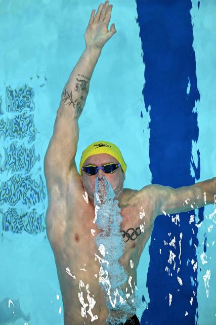 Australia's Isaac Cooper competes in the Men's 100m Backstroke - Heats at the swimming event at the Tollcross International Swimming Centre in Glasgow, on day five of the Commonwealth Games in Glasgow, Scotland, on July 28, 2026. (Photo by Oli SCARFF / AFP)