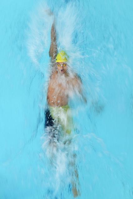 Jamaica's Collin McKenzie takes part the Mixed 4 x 100m Medley Relay - Heats swimming event at the Tollcross International Swimming Centre in Glasgow, on day five of the Commonwealth Games in Glasgow, Scotland, on July 28, 2026. (Photo by Oli SCARFF / AFP)