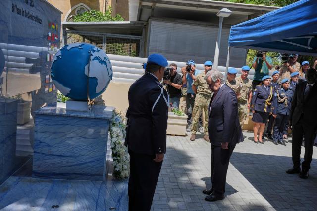 United Nations Secretary-General Antonio Guterres attends a wreath-laying ceremony at the Ledra Palace Hotel in the UN-controlled buffer zone in the divided capital of Nicosia, Cyprus, on July 28, 2026. United Nations chief Antonio Guterres said he held two "very constructive" separate meetings with rival Cypriot leaders on July 28, ahead of a trilateral meeting to weigh the prospect of fresh negotiations nine years after the peace process collapsed. (Photo by Petros Karadjias / POOL / AFP)