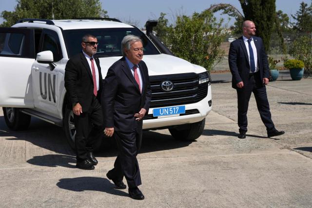 United Nations Secretary-General Antonio Guterres (2nd-L) arrives at the Committee on Missing Persons inside the UN-controlled buffer zone in the divided capital of Nicosia, Cyprus, on July 28, 2026. United Nations chief Antonio Guterres said he held two "very constructive" separate meetings with rival Cypriot leaders on July 28, ahead of a trilateral meeting to weigh the prospect of fresh negotiations nine years after the peace process collapsed. (Photo by Petros Karadjias / POOL / AFP)