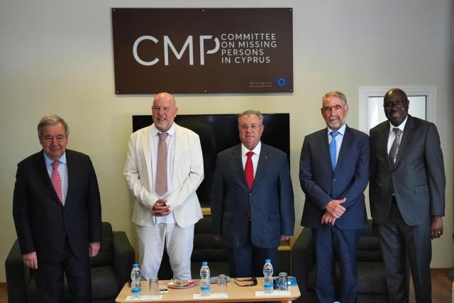 From L-R: United Nations Secretary-General Antonio Guterres, UN third member of the tripartite Committee on Missing Persons in Cyprus Pierre Gentile, Turkish Cypriot Member Hakk? Muftuzade,  Greek Cypriot Member Leonidas Pantelides, and the UN Secretary-General's Special Representative in Cyprus Khassim Diagne, pose for a photo during their meeting at the Committee on Missing Persons inside the UN-controlled buffer zone in the divided capital of Nicosia, Cyprus, on July 28, 2026. United Nations chief Antonio Guterres said he held two "very constructive" separate meetings with rival Cypriot leaders on July 28, ahead of a trilateral meeting to weigh the prospect of fresh negotiations nine years after the peace process collapsed. (Photo by Petros Karadjias / POOL / AFP)