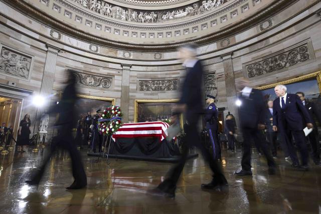 People pay their respects at the casket during a Congressional tribute to late US Senator Lindsey Graham in the Rotunda of the US Capitol in Washington, DC, on July 28, 2026. Graham, a South Carolina Republican and key Trump ally who was elected to the Senate four times, died at age 71 on July 11. (Photo by JIM LO SCALZO / POOL / AFP)