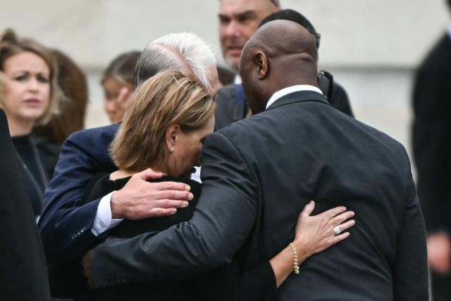 US Senator Darline Graham, Republican from South Carolina, is embraced by Senator Tim Scott, Republican from South Carolina, and former US Representative Trey Gowdy, following a Congressional tribute to late US Senator Lindsey Graham at the US Capitol in Washington, DC, on July 28, 2026. Graham, a South Carolina Republican and key Trump ally who was elected to the Senate four times, died at age 71 on July 11. (Photo by Kent NISHIMURA / AFP)