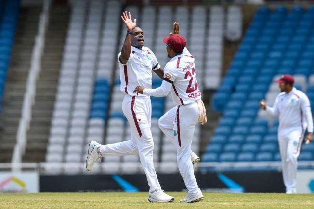 Justin Greaves (L) of West Indies celebrates the dismissal of Mohammad Rizwan of Pakistan during the fourth day of the first Test cricket match between West Indies and Pakistan at the Brian Lara Cricket Academy in Tarouba, Trinidad and Tobago, on July 28, 2026. (Photo by Randy Brooks / AFP)