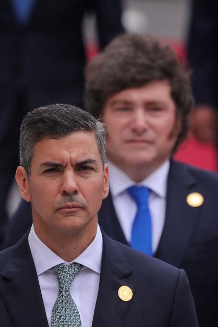 Paraguay's President Santiago Pena and Argentina's President Javier Milei arrive for Peru's President-elect Keiko Fujimori's inauguration in Lima on July 28, 2026. Fujimori will take office on July 28, 2026, vowing to tackle the wave of crime sweeping the Andean nation. Fujimori won the June 7 presidential runoff by fewer than 50,000 votes, after losing the past three runoffs. (Photo by AFP)