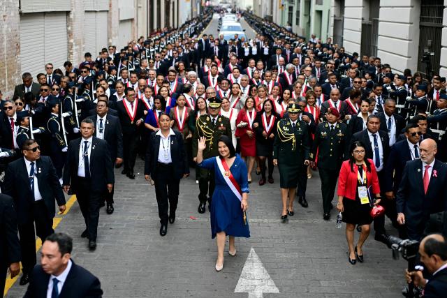 Peru's President Keiko Fujimori walks toward the Government Palace after leaving Congress following her inauguration ceremony in Lima on July 28, 2026. Fujimori took office on July 28, 2026, vowing to tackle the wave of crime sweeping the Andean nation. Fujimori won the June 7 presidential runoff by fewer than 50,000 votes, after losing the past three runoffs. (Photo by ERNESTO BENAVIDES / AFP)