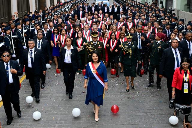 Peru's President Keiko Fujimori walks toward the Government Palace after leaving Congress following her inauguration ceremony in Lima on July 28, 2026. Fujimori took office on July 28, 2026, vowing to tackle the wave of crime sweeping the Andean nation. Fujimori won the June 7 presidential runoff by fewer than 50,000 votes, after losing the past three runoffs. (Photo by ERNESTO BENAVIDES / AFP)