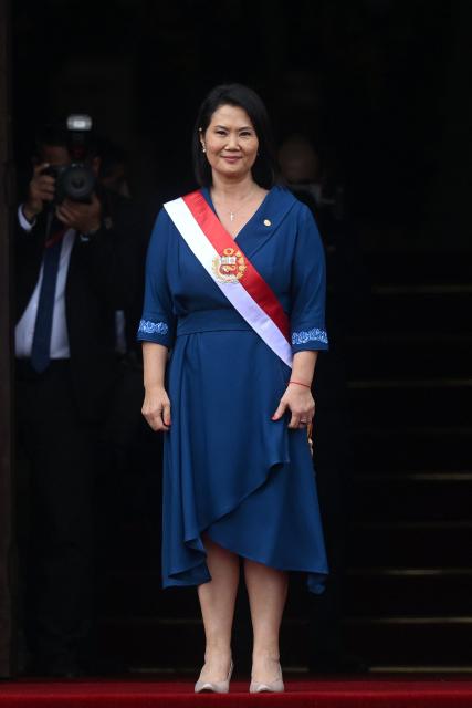 Peru's President Keiko Fujimori stands an the entrance of the Government Palace following her inauguration ceremony in Lima on July 28, 2026. Fujimori took office on July 28, 2026, vowing to tackle the wave of crime sweeping the Andean nation. Fujimori won the June 7 presidential runoff by fewer than 50,000 votes, after losing the past three runoffs. (Photo by Connie FRANCE / AFP)