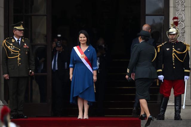Peru's President Keiko Fujimori stands an the entrance of the Government Palace following her inauguration ceremony in Lima on July 28, 2026. Fujimori took office on July 28, 2026, vowing to tackle the wave of crime sweeping the Andean nation. Fujimori won the June 7 presidential runoff by fewer than 50,000 votes, after losing the past three runoffs. (Photo by Connie FRANCE / AFP)