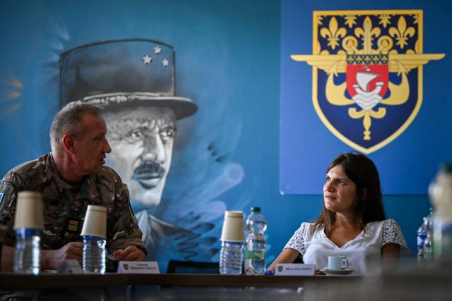 France's junior Minister for Veterans affairs Alice Rufo (R) attends a presentation meeting at the Camp des Loges, military base in Saint-Germain-en-Laye, near Paris, on July 29, 2026. (Photo by Lou BENOIST / AFP)