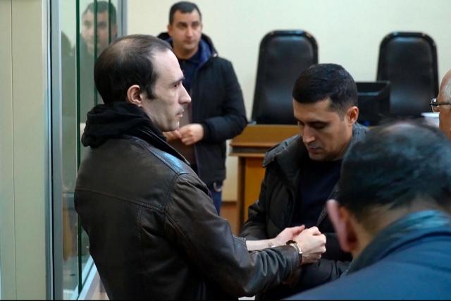 (FILES) This grab taken from footage released by AFP video shows French national Martin Ryan (L) during a court hearing as part of his trial on spy charges in Baku on January 6, 2025. Azerbaijani justice on appeal upheld the conviction of Martin Ryan, to ten years in prison for "espionage," a case born amid tensions between Paris and Baku, the appeals court told AFP on July 29, 2026. (Photo by AFPTV STRINGER / AFP)
