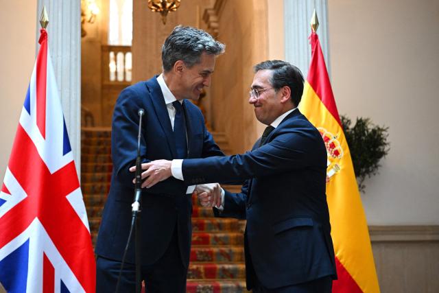 British Foreign Secretary Ed Miliband (L) shakes hands with Spanish Foreign Minister Jose Manuel Albares at the Palacio de Viana in Madrid on July 29, 2026.  (Photo by Leon Neal / POOL / AFP)