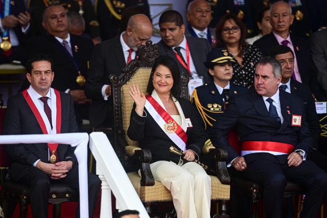 Peru's President Keiko Fujimori waves from her stand during a military parade to celebrate Peru's National Holidays, in Lima on July 29, 2026. (Photo by ERNESTO BENAVIDES / AFP)