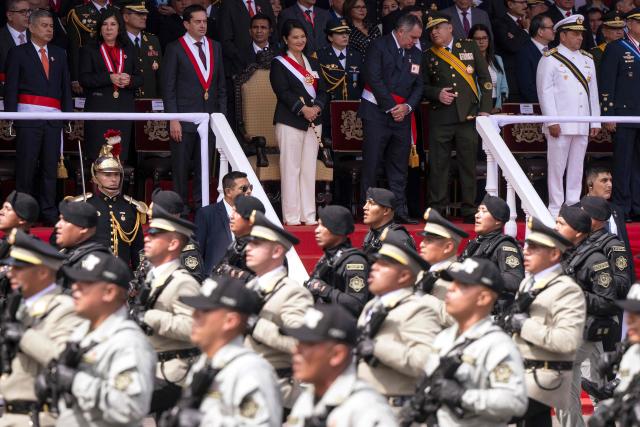 Peru's President Keiko Fujimori (C) inspect the troops during a military parade to celebrate Peru's National Holidays, in Lima on July 29, 2026. (Photo by ERNESTO BENAVIDES / AFP)