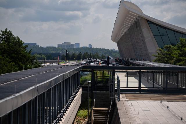 The main terminal of Dulles International Airport (IAD) is seen in Dulles, Virginia, on July 29, 2026. US President Donald Trump is set to unveil a $20 billion plan to rebuild and renovate Washington Dulles International Airport. (Photo by Kent Nishimura / AFP)