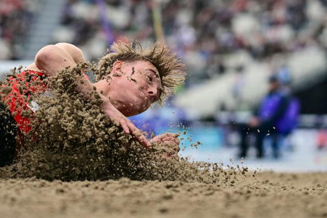 Isle of Man's Regan Corrin competes in the men's long jump final during the athletics event at the Scotstoun Stadium in Glasgow, on day six of the Commonwealth Games in Glasgow, Scotland, on July 29, 2026. (Photo by Ben STANSALL / AFP)