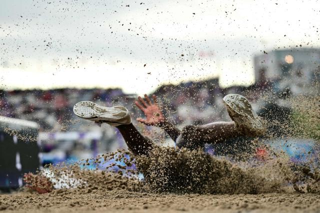 Saint Vincent and the Grenadines' Uroy Ryan competes in the men's long jump final during the athletics event at the Scotstoun Stadium in Glasgow, on day six of the Commonwealth Games in Glasgow, Scotland, on July 29, 2026. (Photo by Ben STANSALL / AFP)