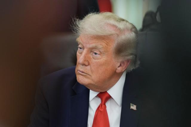 US President Donald Trump looks on during an announcement about Dulles International Airport renovations in the Oval Office of the White House in Washington, DC on July 29, 2026. (Photo by Ken Cedeno / AFP)