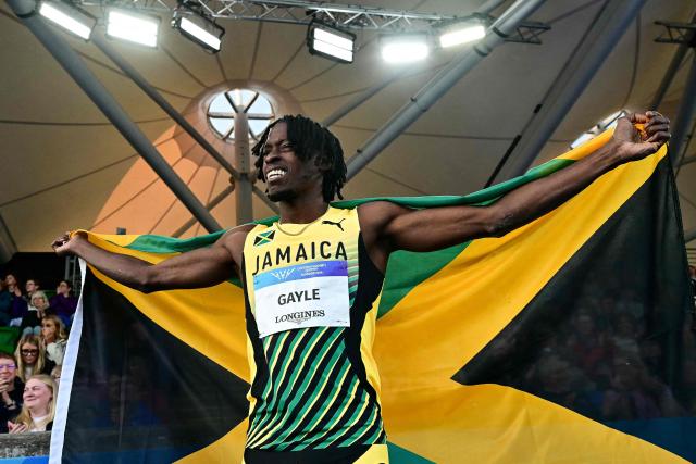 First-placed Jamaica's Tajay Gayle celebrates after competing in the men's long jump final during the athletics event at the Scotstoun Stadium in Glasgow, on day six of the Commonwealth Games in Glasgow, Scotland, on July 29, 2026. (Photo by Ben STANSALL / AFP)