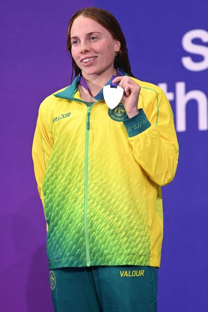 Silver medallist Australia's Emily Beecroft celebrates during the Women's S9 100m Freestyle Medal Ceremony at the swimming event at the Tollcross International Swimming Centre in Glasgow, on day six of the Commonwealth Games in Glasgow, Scotland, on July 29, 2026. (Photo by Oli SCARFF / AFP)