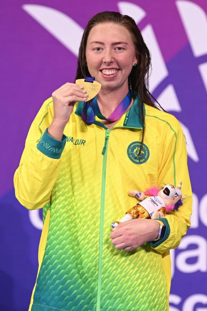 Gold medallist Australia's Lakeisha Patterson celebrates during the Women's S9 100m Freestyle Medal Ceremony at the swimming event at the Tollcross International Swimming Centre in Glasgow, on day six of the Commonwealth Games in Glasgow, Scotland, on July 29, 2026. (Photo by Oli SCARFF / AFP)